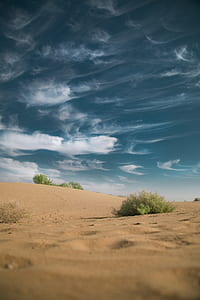 landscape photo of desert under cumulus clods thumbnail