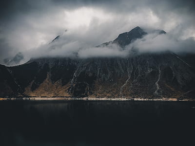 mountain range covered with clouds thumbnail