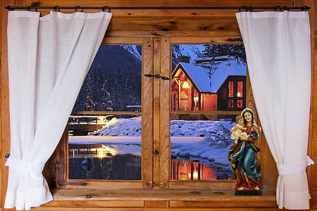 religious figurine near window panel thumbnail