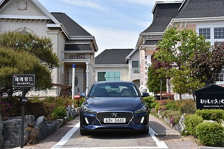 blue Hyundai vehicle parked on front of building thumbnail