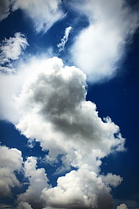 blue sky over white and grey clouds thumbnail
