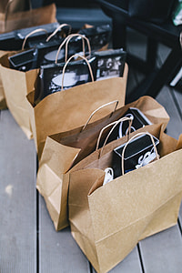 Brown paper shopping bags full of decorations thumbnail