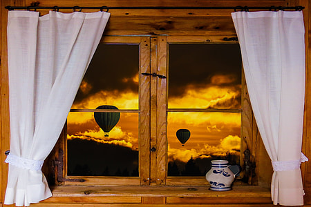 white and blue ceramic vase beside white wooden window with two white curtains thumbnail