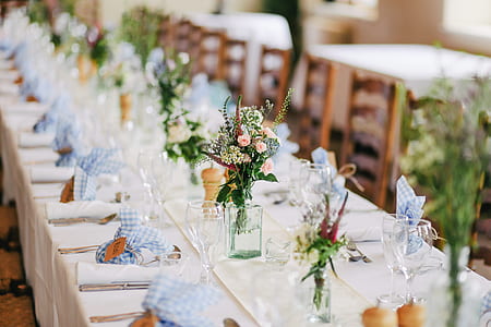 clear long-stemmed and plates on table thumbnail