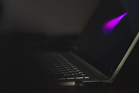 turned-on gray laptop computer on desk thumbnail