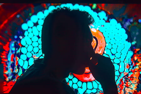 Silhouette of Man With Right Hand on Lips thumbnail