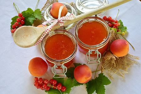 two clear glass jars with red liquid thumbnail