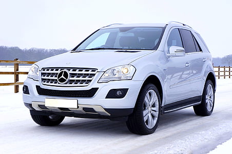 silver Mercedes-Benz ML-Class SUV on snow field thumbnail