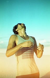 man in white tank top thumbnail