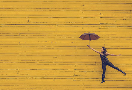 woman holds umbrella to float thumbnail