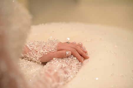 person wearing beaded white long-sleeved top thumbnail