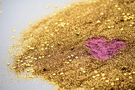 gold and pink glitter scattered on the floor thumbnail
