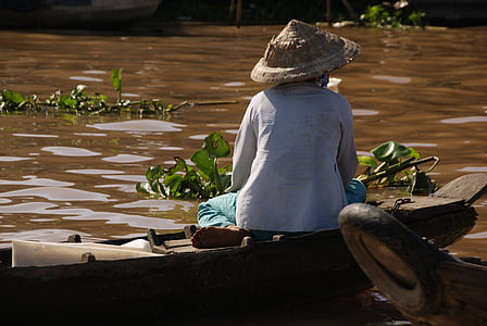 woman sitting on wooden boat thumbnail