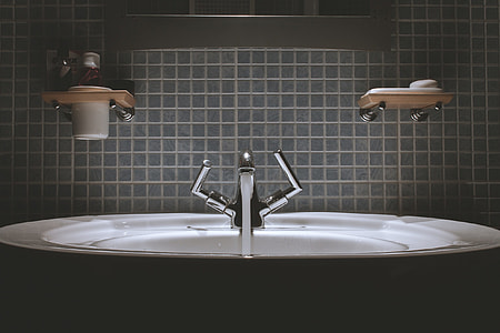 white ceramic bath tub with faucet in the room thumbnail
