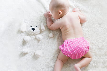 baby crawling on white pad thumbnail