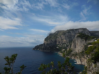 landscape photography of mountain near body of water thumbnail