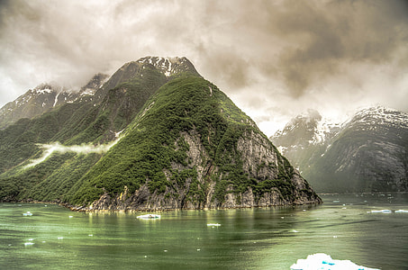Black Clouds over rising hills in the Fjord around Juneau, Alaska thumbnail