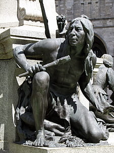 statue of man holding staff thumbnail