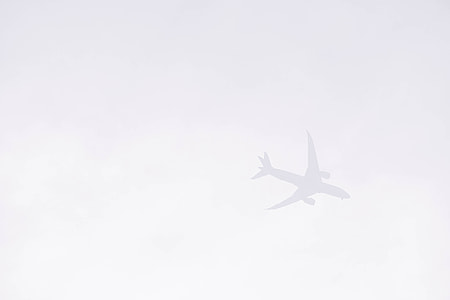 gray skies with plane thumbnail