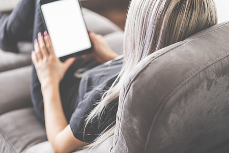 Young Woman Reading eBooks on Her Pocket Reader thumbnail