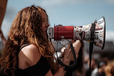 woman wearing black top using megaphone thumbnail