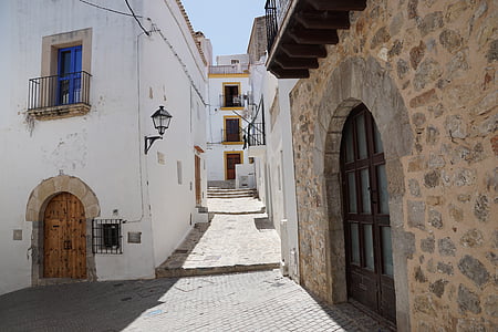 empty concrete alley between buildings at daytime thumbnail