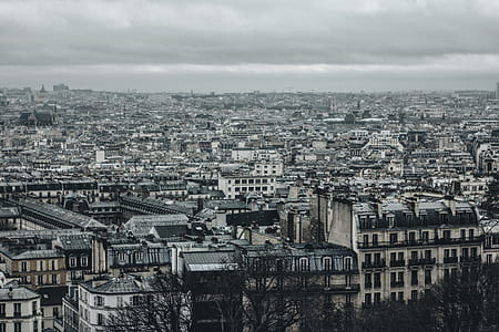 city buildings under cloudy sky during daytime thumbnail