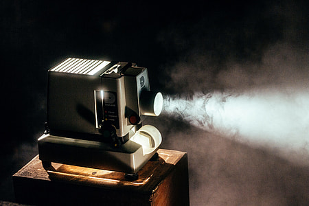 black and beige LED projector turned on thumbnail