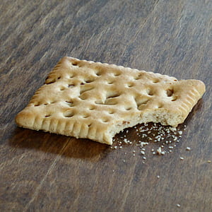 biscuit placed on brown wooden surface thumbnail