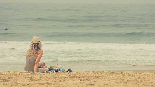 woman sitting on seashore thumbnail