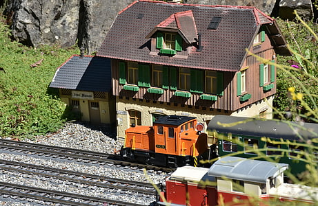 white and green wooden train station\ thumbnail