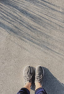 person standing on gray sand thumbnail