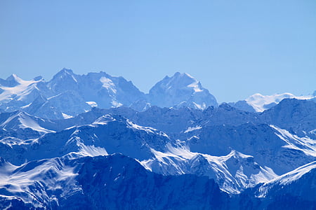 snow covered mountain with blue sky thumbnail