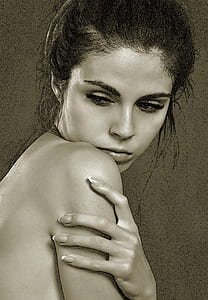 grayscale photography of a topless woman holding her right shoulder thumbnail