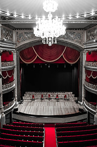 turned on crystal chandelier inside theater thumbnail