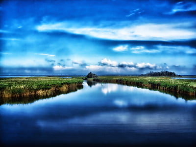 river in the middle of field thumbnail
