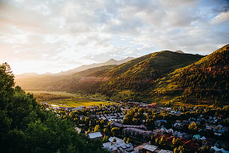 aerial photograph of a village near mountain thumbnail
