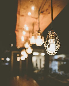 selective focus photography of brown ceiling pendant lamp thumbnail