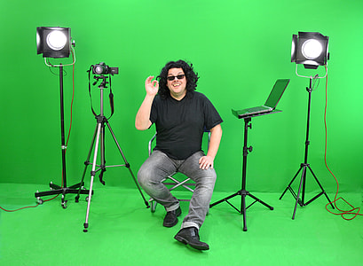man sitting on chair in between of lights thumbnail