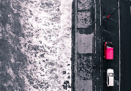 aerial photography of pink and white cars on road thumbnail