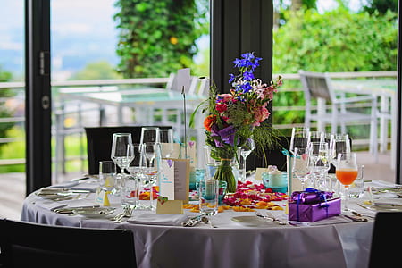 round table with white tablecloth and wine glasses thumbnail