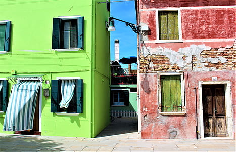 photography of red and green concrete building during daytime thumbnail