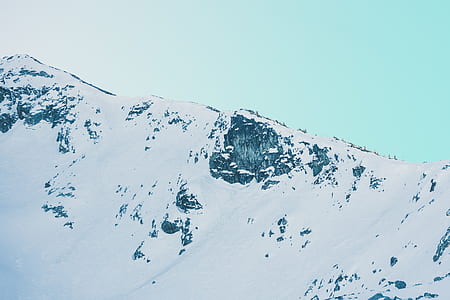 snow-covered mountain under blue sky thumbnail