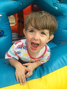 boy inside bounce house thumbnail