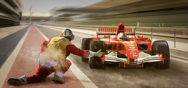 man kneeling near go kart thumbnail