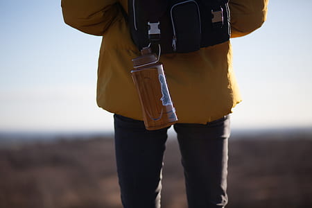 sports bottle hanged on backpack thumbnail