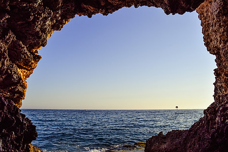 body of water near rock thumbnail