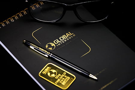 black click pen on Global Intergold book thumbnail
