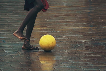 person standing in front of yellow ball thumbnail