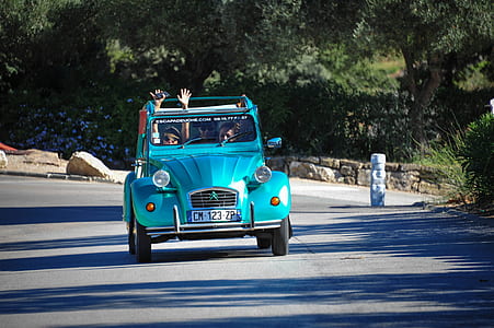 three person riding on Citroen car during daytime thumbnail